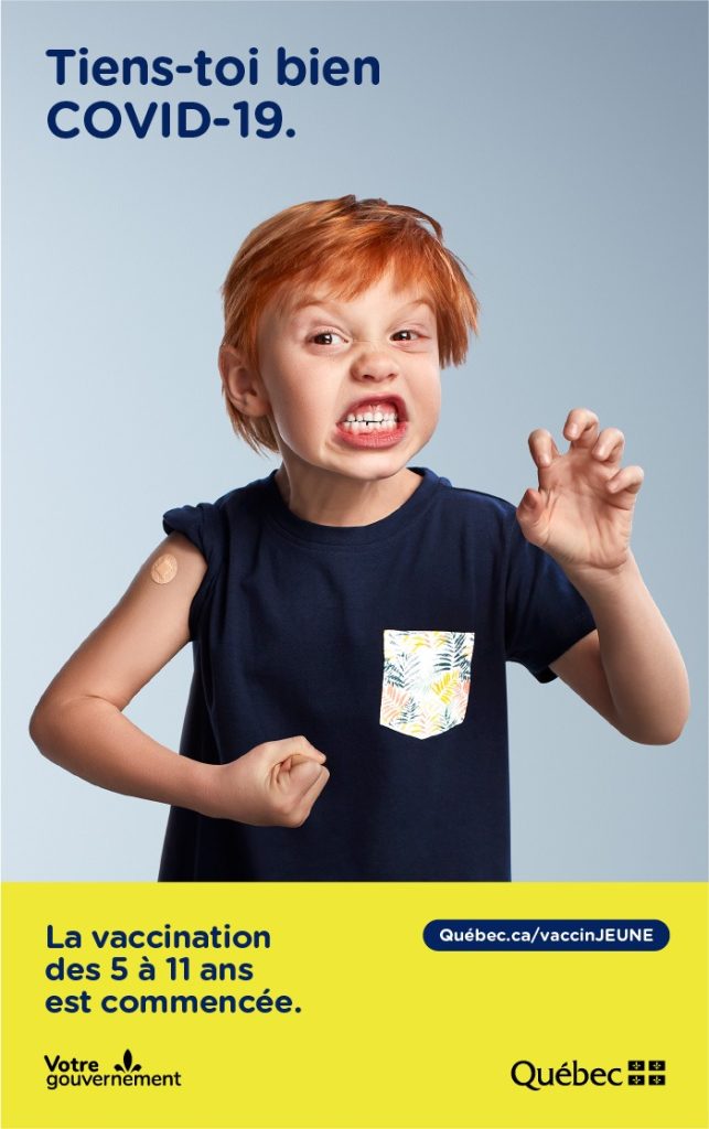 Affiche « Tiens-toi bien, COVID-19 » : grimace d’un enfant roux, la vaccination des 5 à 11 ans est commencée, Gouvernement du Québec